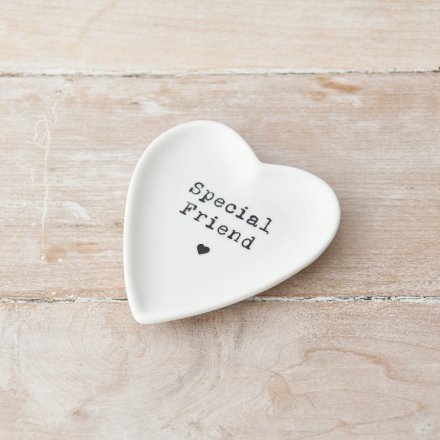 Heart shaped white ceramic trinket dish with the quote 'special friend' printed on in a typewriter front. Underneath is a small heart.