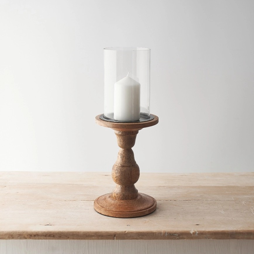 Wooden pillar candle holder with glass tube on top to sit candle in. 