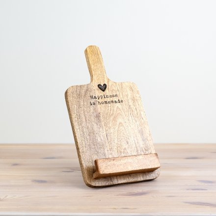 Wooden rustic recipe board stand with small shelf to hold recipe book. At the top features the quote 'Happiness is homemade' engraved in the wood. Above the quote is a small engraved heart. 
