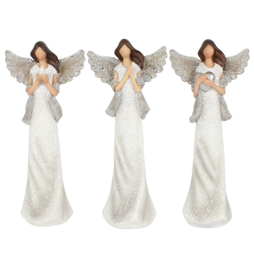 Three angel figurines with white dresses and silver wings on a white background