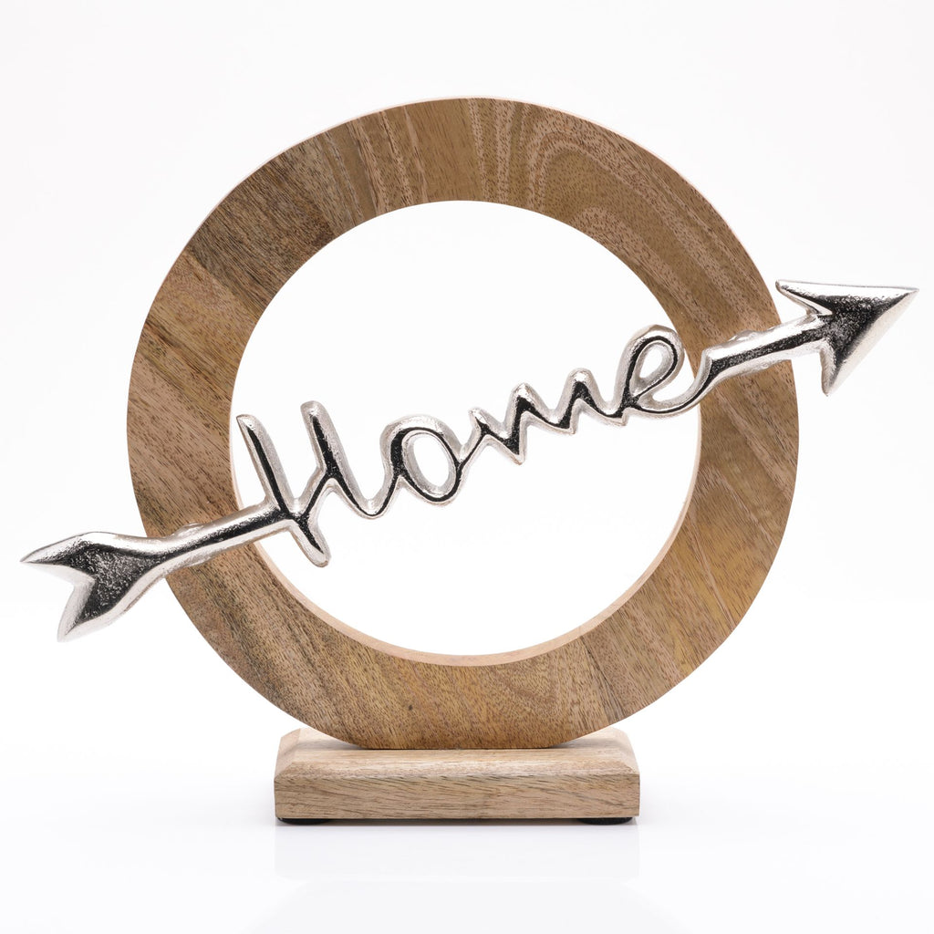 Wooden thick circle outline on wooden base with an aluminium arrow going across the circle with the word 'home' written through the middle of the arrow.