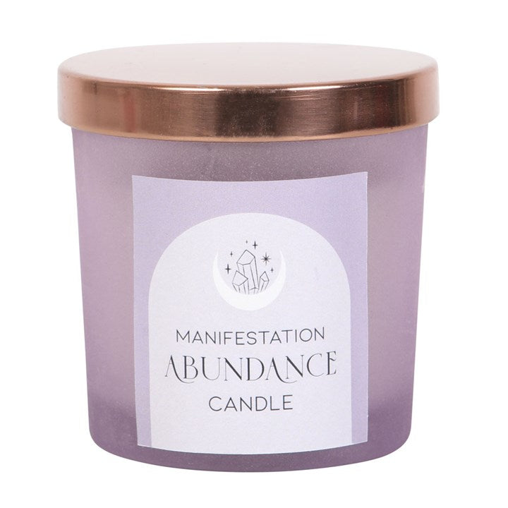Purple frosted glass candle with copper-tone lid. Inside is a white candle with small amethyst crystals embedded into the wax. 