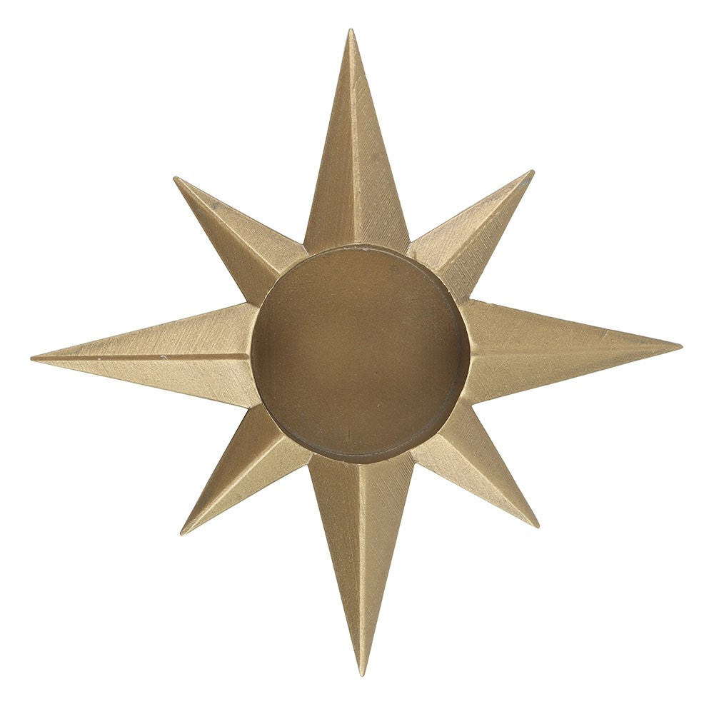 Gold star-shaped candle holder on a white background
