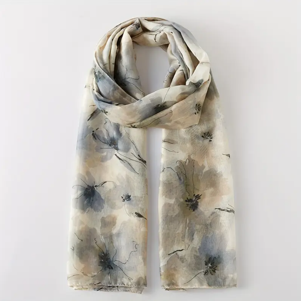 Soft cream scarf with pale blue floral design with a watercolour effect. 