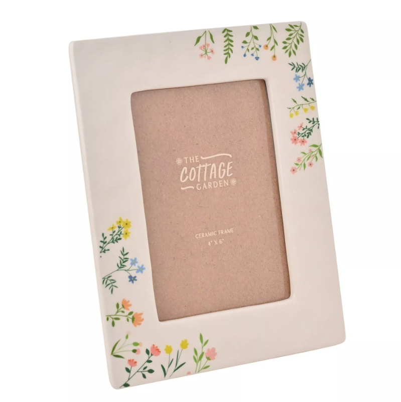Floral photo frame with 'The Cottage Garden' branding on a white background