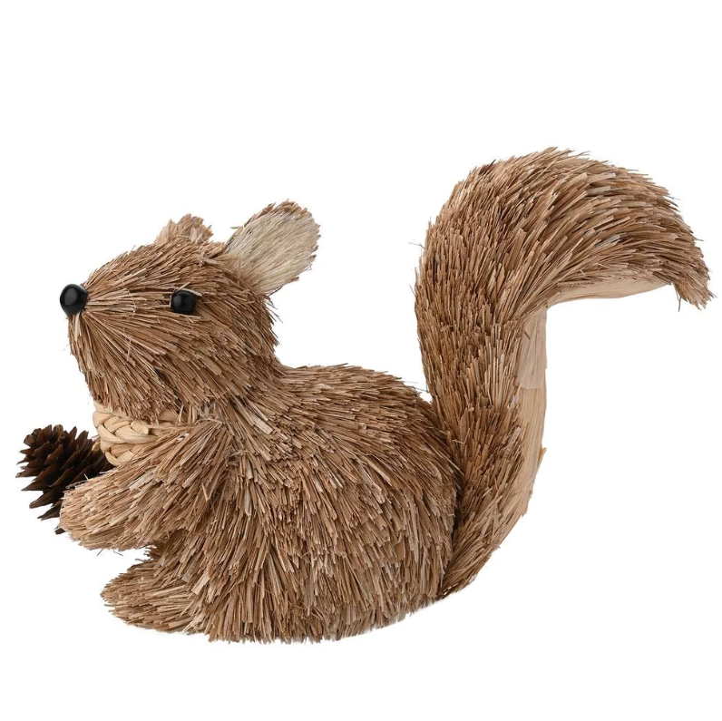 Textured squirrel figurine holding a pine cone on a white background