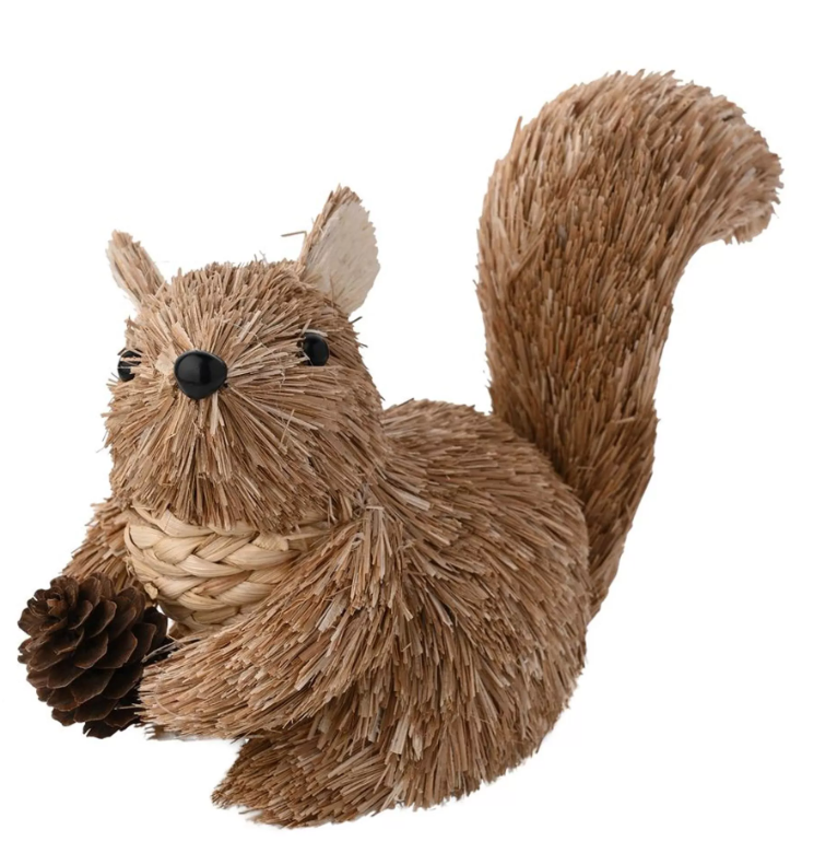 Rattan squirrel decoration with a pine cone on a white background