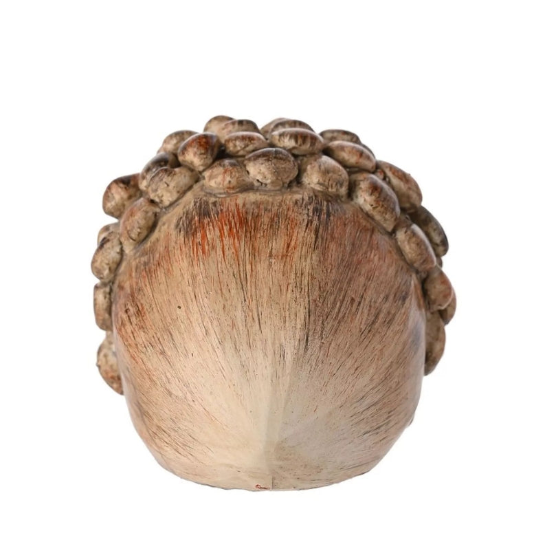 Wooden acorn-shaped object on a white background