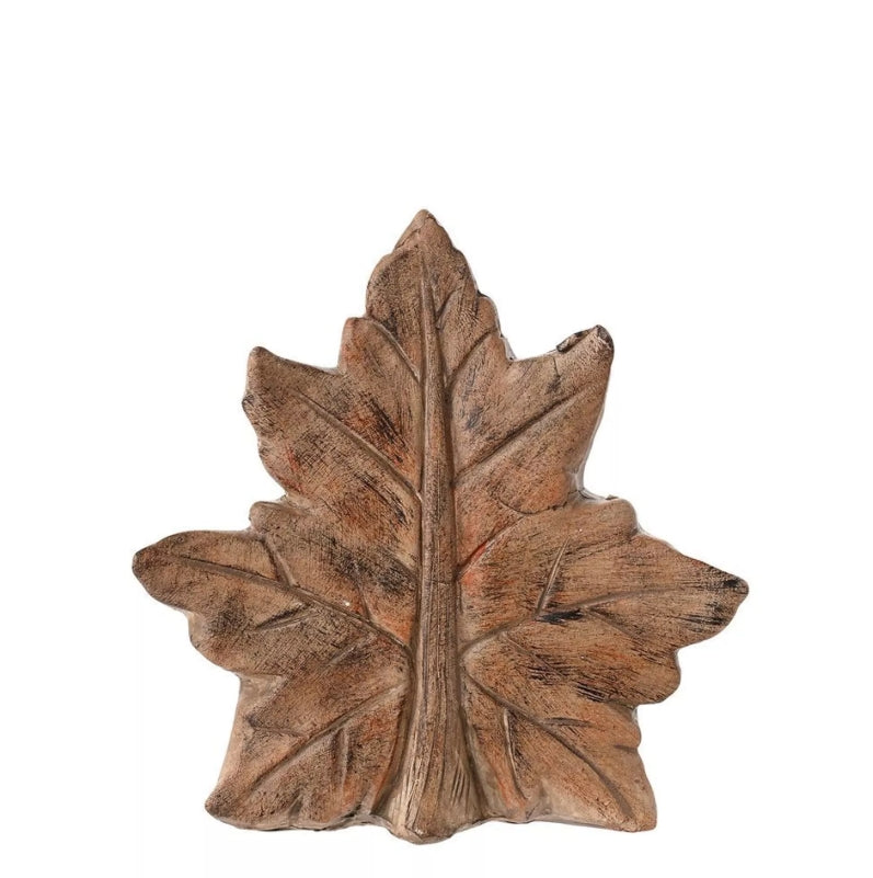 Wooden leaf-shaped decorative item on a white background