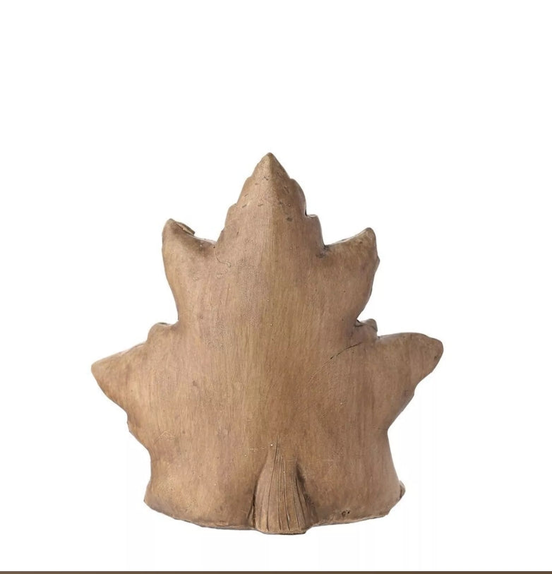 Wooden leaf-shaped object on a white background