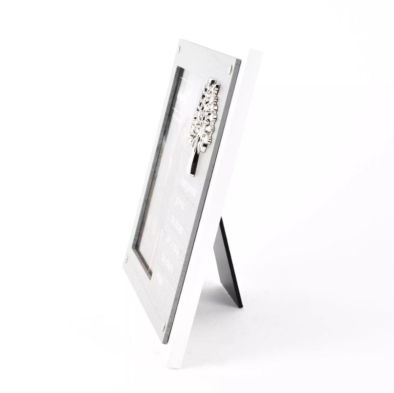Silver photo frame with a decorative design on a white background