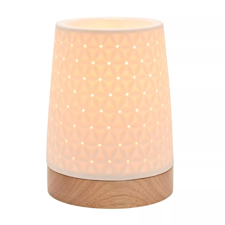 Cylindrical lamp with wooden base and textured white shade on a white background