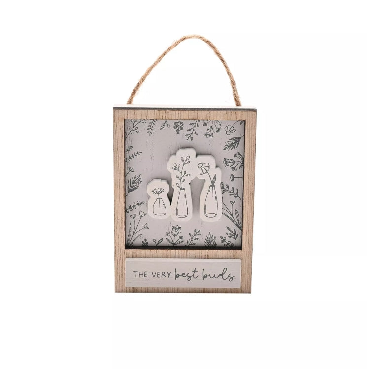 Decorative wall hanging with floral design and 'The Very Best Buds' text on a white background