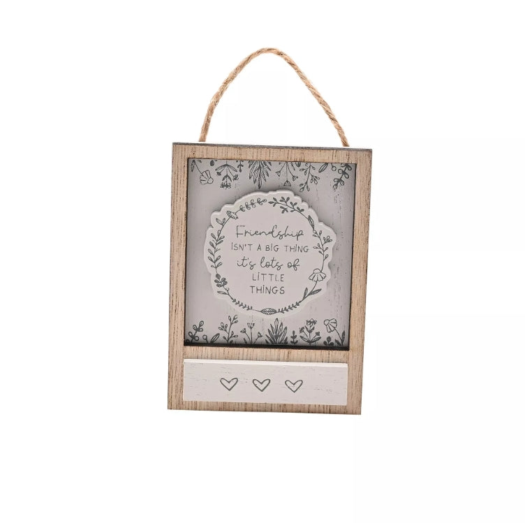 Decorative hanging sign with text and heart symbols on a white background