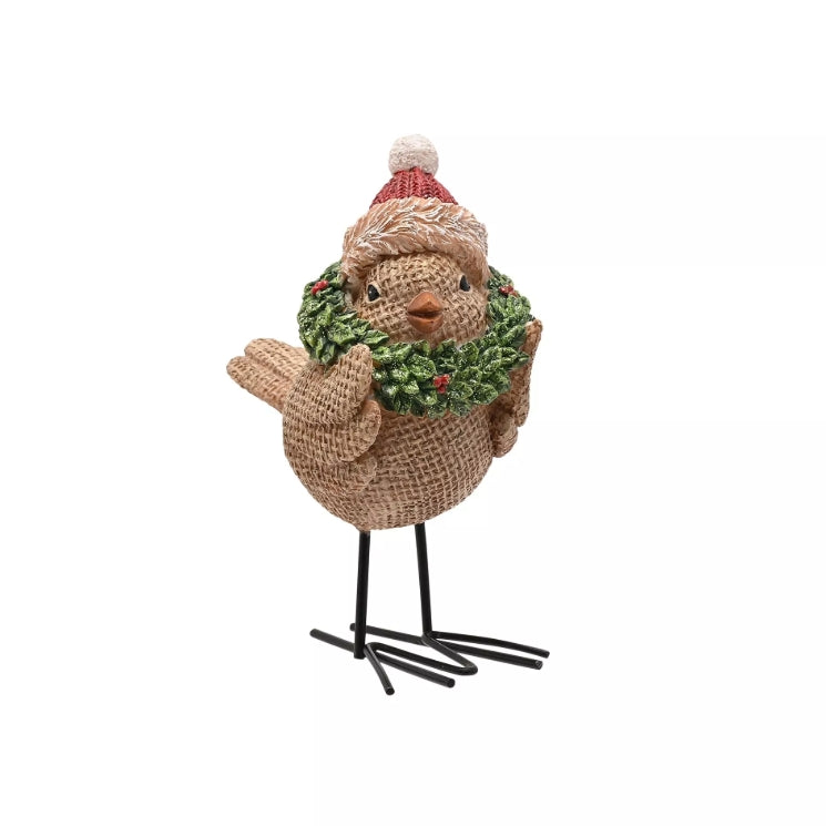 Decorative bird figurine wearing a festive hat and scarf on a white background
