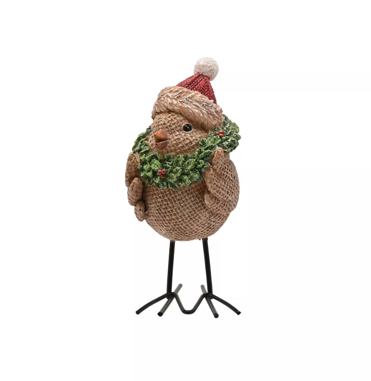 Decorative figure of a bird wearing a Santa hat and wreath on a white background