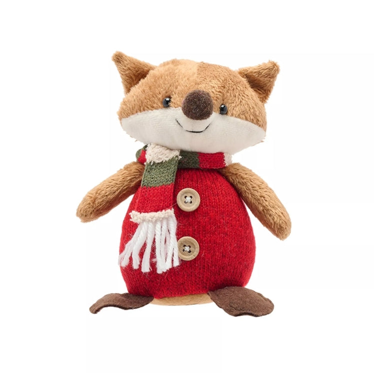 Stuffed toy fox wearing a red sweater with buttons on a white background
