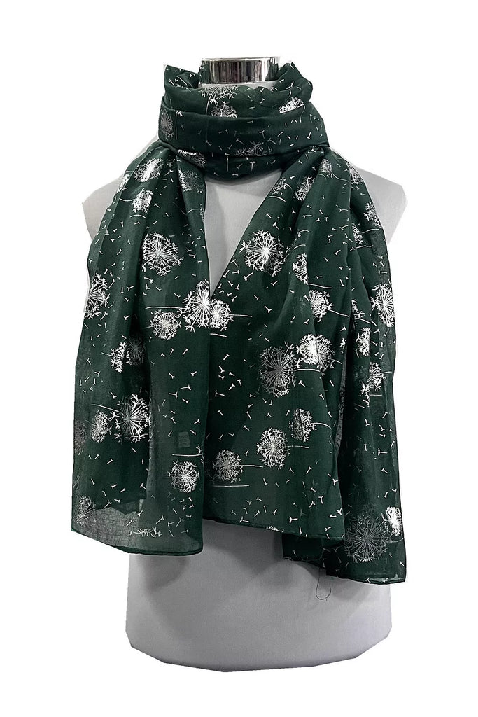 Green scarf with white floral pattern on a mannequin against a white background